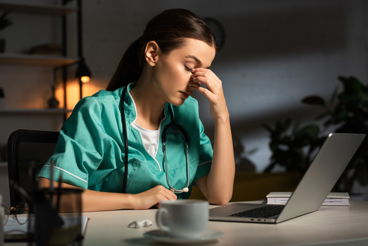 Tired nurse at work exhausted from night shift
