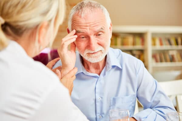 Confused elderly man with Alzheimer's disease or another form of dementia