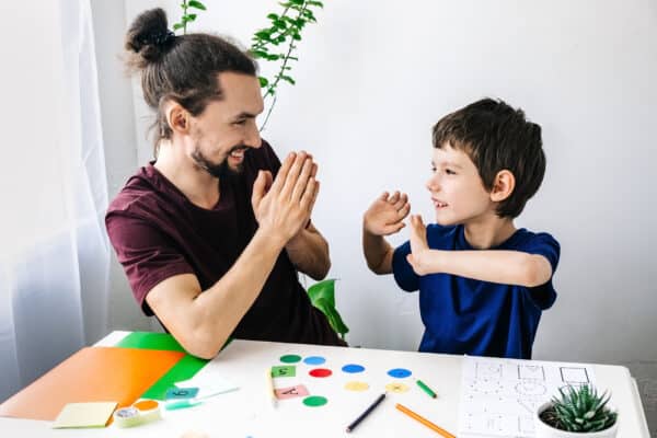 An autistic child playing with parent