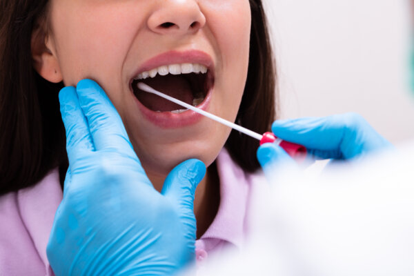Doctor Taking A Bodily Fluid Swab For DNA Test