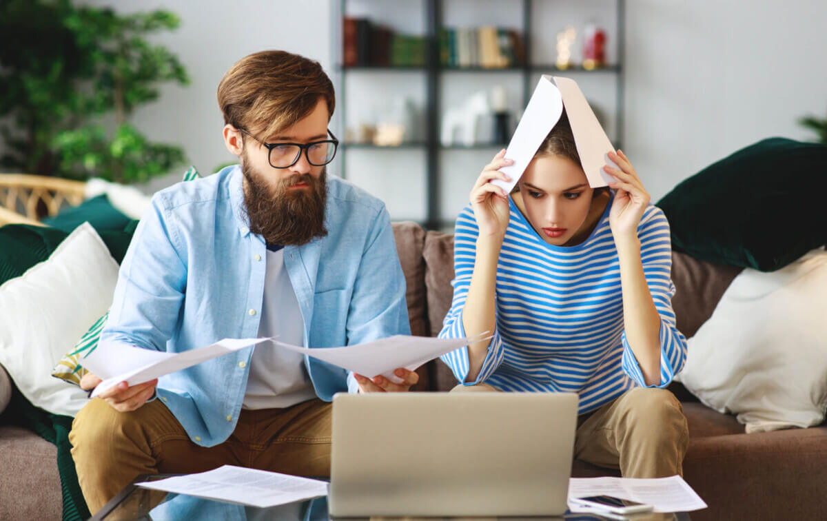 Couple stressed over bills, money, debt