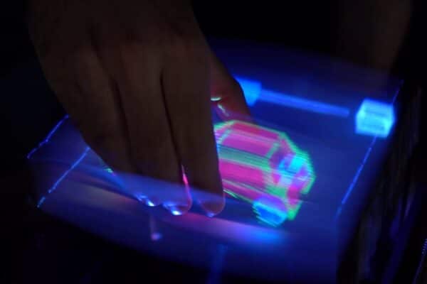A 3D car is grabbed and rotated by a user.