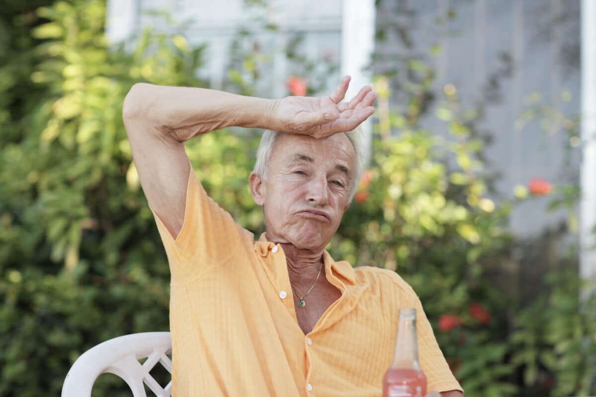 Man wiping off his sweat