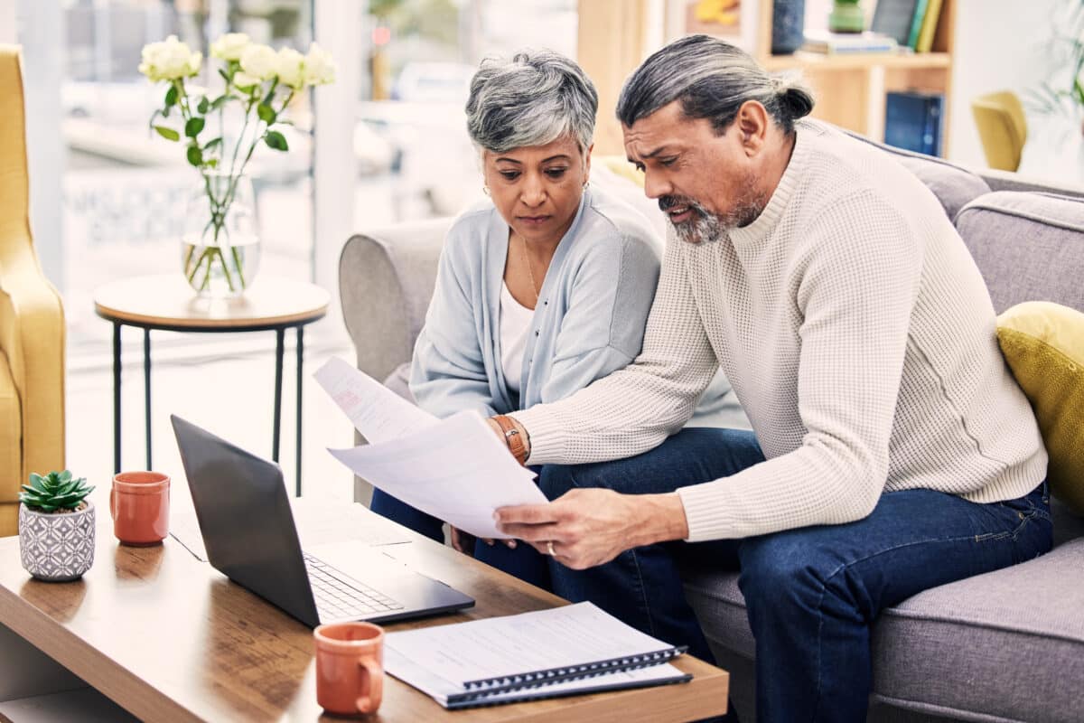 Older couple looking at bills