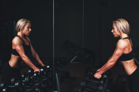 Woman lifting weights at gym