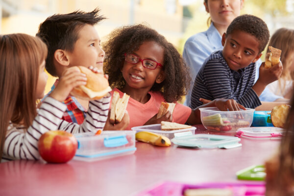 School children eating lunch together
