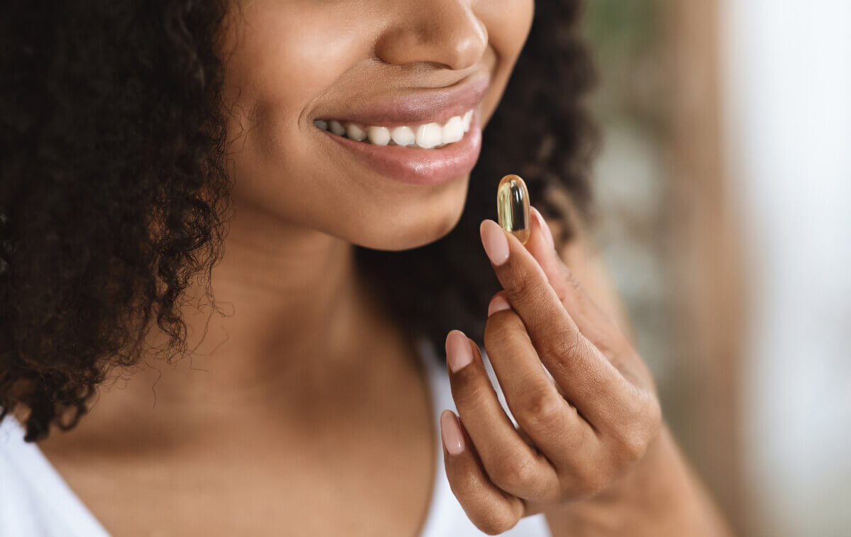 A woman taking a supplement