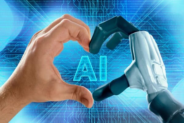 A robot hand and human hand forming a heart