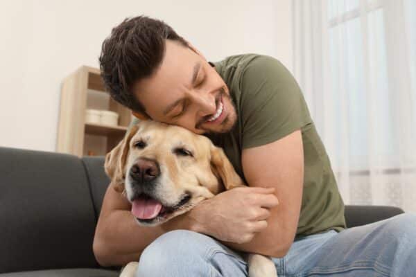 Man hugging a dog