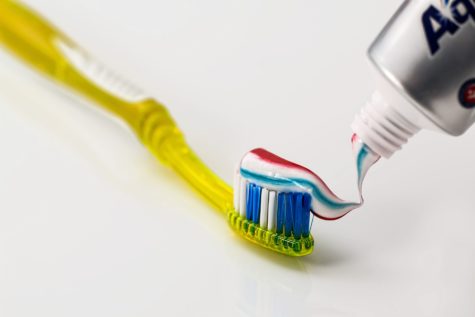 Toothbrush with toothpaste for brushing teeth