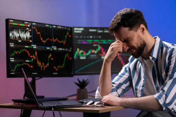A man frustrated about stock or crypto changing.
